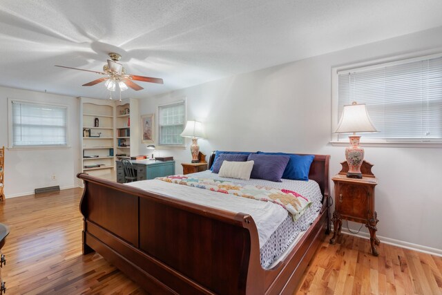 103 Forrest Hills Dr, Dickson, TN 37055 - bedroom featuring light wood-style flooring, baseboards, and ceiling fan