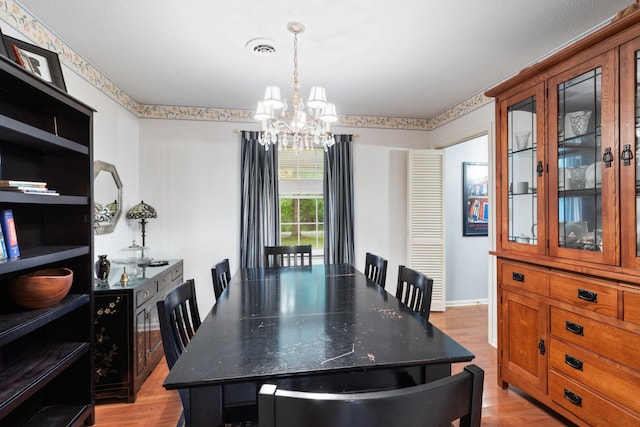 103 Forrest Hills Dr, Dickson, TN 37055 - dining room featuring a chandelier and light wood-style floors