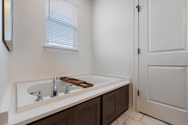 full bath with marble finish floors and a bath