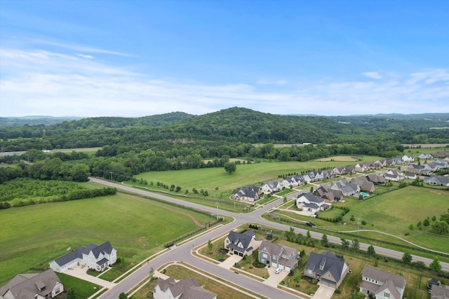 aerial view of residential area featuring a heavily wooded area