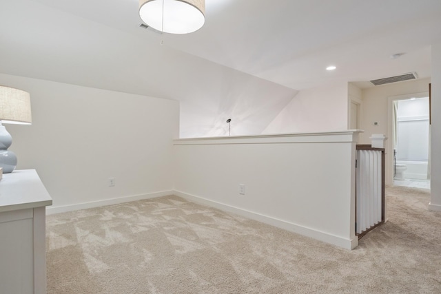 bonus room with light colored carpet, baseboards, and recessed lighting