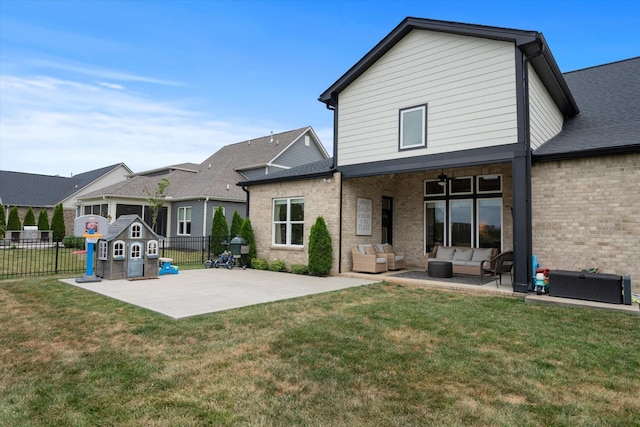 back of property with an outdoor hangout area, a patio area, brick siding, a ceiling fan, and a shingled roof