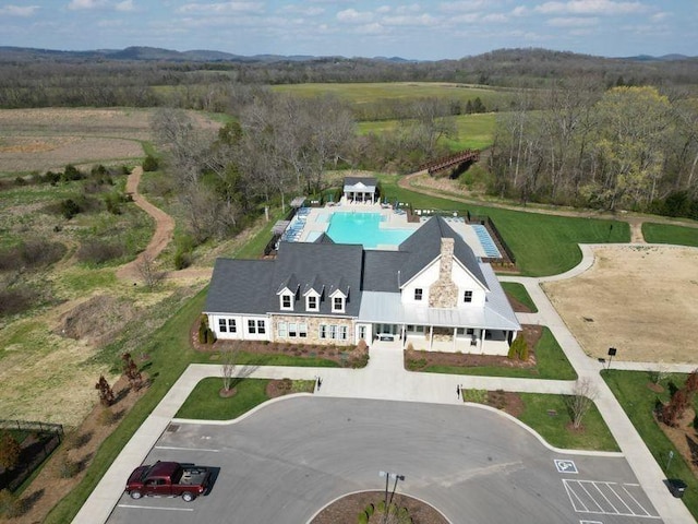 view of subject property featuring a pool area