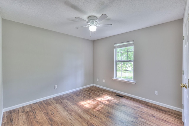 1716 Golden Valley Dr, Christiana, TN 37037 - empty room featuring baseboards, wood finished floors, a ceiling fan, and a textured ceiling