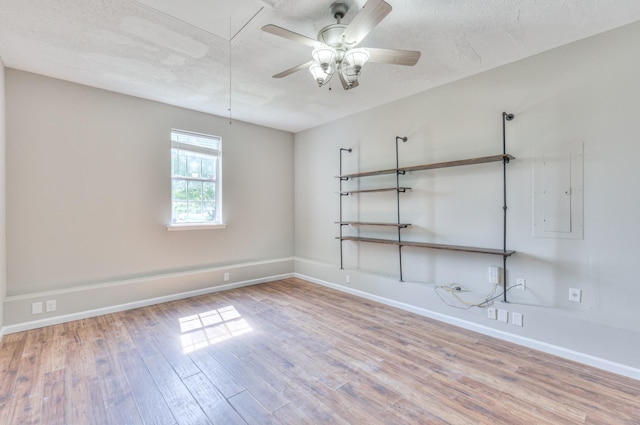 1716 Golden Valley Dr, Christiana, TN 37037 - empty room featuring attic access, wood finished floors, baseboards, a ceiling fan, and a textured ceiling