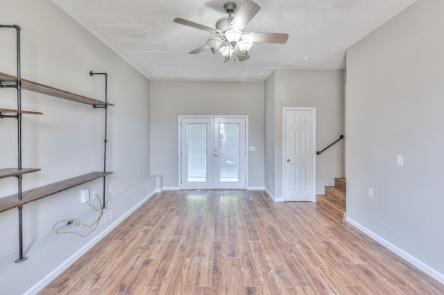 1716 Golden Valley Dr, Christiana, TN 37037 - spare room with wood finished floors, stairs, a ceiling fan, french doors, and baseboards