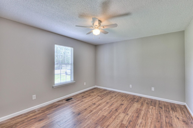 1716 Golden Valley Dr, Christiana, TN 37037 - empty room with a ceiling fan, wood finished floors, baseboards, and a textured ceiling