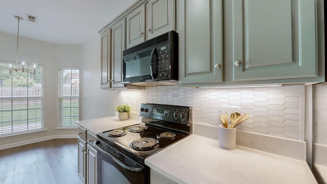 2014 Patrick Way, Spring Hill, TN 37174 - kitchen with black appliances, dark wood-type flooring, tasteful backsplash, light countertops, and decorative light fixtures