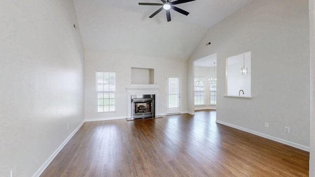 2014 Patrick Way, Spring Hill, TN 37174 - unfurnished living room with plenty of natural light, ceiling fan, dark wood finished floors, baseboards, and high vaulted ceiling