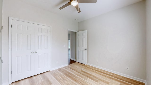 2014 Patrick Way, Spring Hill, TN 37174 - unfurnished bedroom with light wood-style floors, a closet, and baseboards