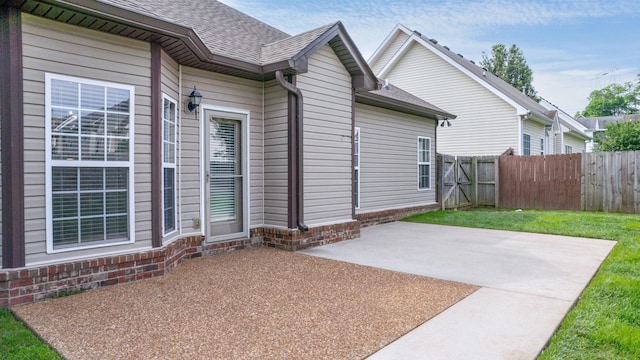 2014 Patrick Way, Spring Hill, TN 37174 - view of side of property with a patio, fence, and a shingled roof