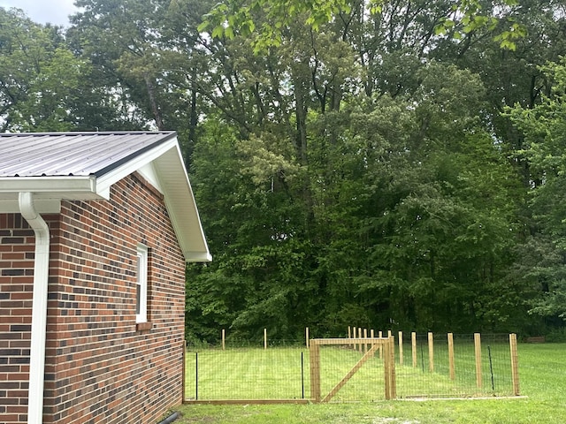 148 Shawna Ln, Hillsboro, TN 37342 - view of home's exterior with brick siding and metal roof