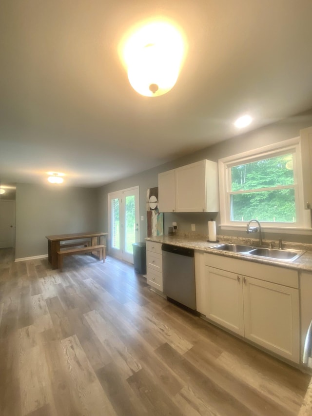 148 Shawna Ln, Hillsboro, TN 37342 - kitchen featuring dishwasher, a sink, light wood-style flooring, and white cabinetry