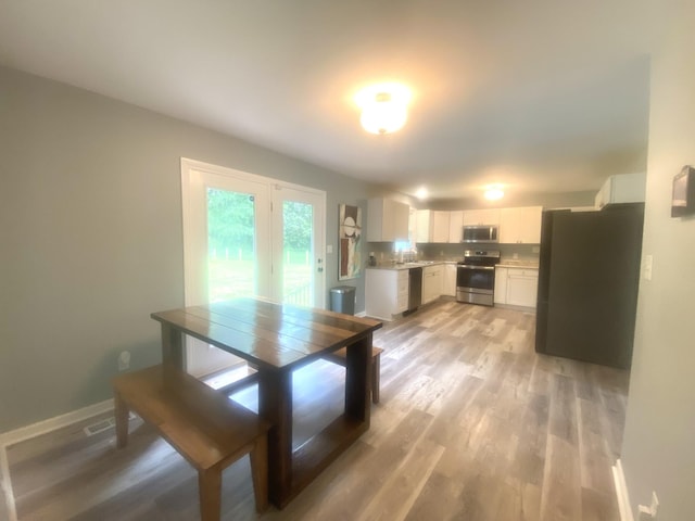 148 Shawna Ln, Hillsboro, TN 37342 - dining room featuring light wood-style floors and baseboards