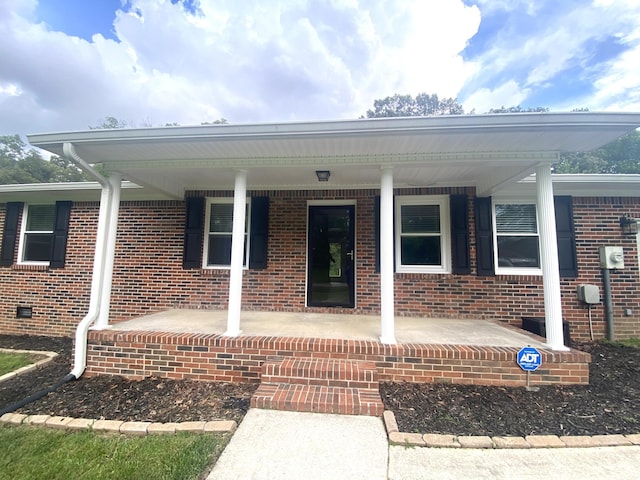 148 Shawna Ln, Hillsboro, TN 37342 - doorway to property featuring covered porch and brick siding