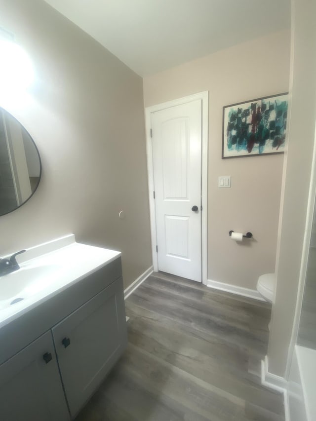 148 Shawna Ln, Hillsboro, TN 37342 - full bathroom with baseboards, vanity, wood finished floors, and toilet