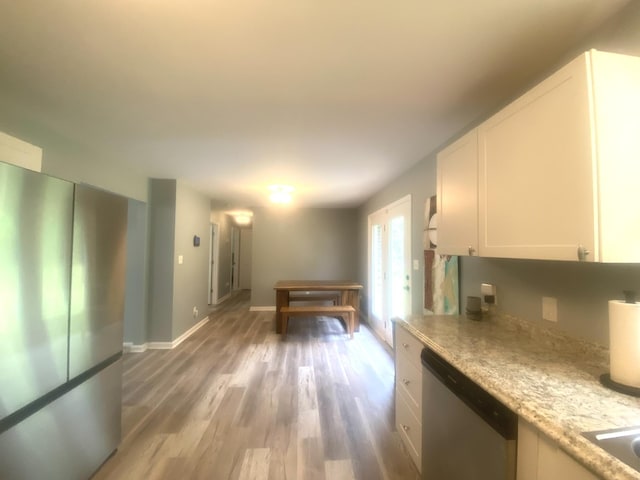 148 Shawna Ln, Hillsboro, TN 37342 - kitchen featuring dishwasher, white cabinets, light wood-type flooring, and baseboards