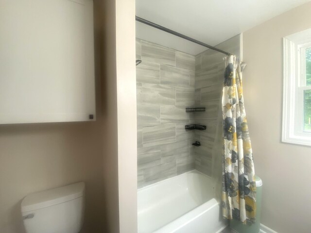 148 Shawna Ln, Hillsboro, TN 37342 - bathroom featuring shower / bath combo with shower curtain, toilet, and baseboards