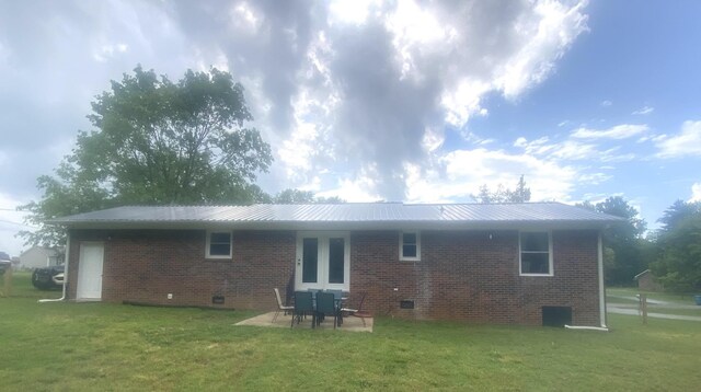 148 Shawna Ln, Hillsboro, TN 37342 - rear view of property featuring brick siding, a yard, crawl space, metal roof, and a patio
