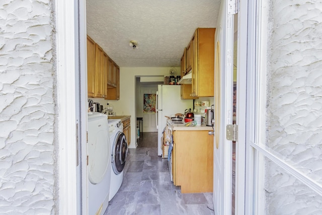 3913 Pickering Ave, Chattanooga, TN 37415 - laundry room with a textured ceiling, washer and clothes dryer, and marble look tile flooring