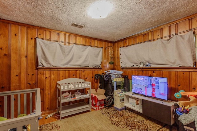 3913 Pickering Ave, Chattanooga, TN 37415 - playroom with a textured ceiling and wooden walls
