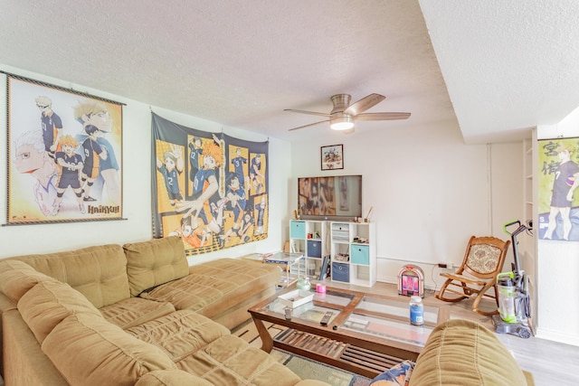 3913 Pickering Ave, Chattanooga, TN 37415 - living room featuring a textured ceiling, a ceiling fan, wood finished floors, and baseboards