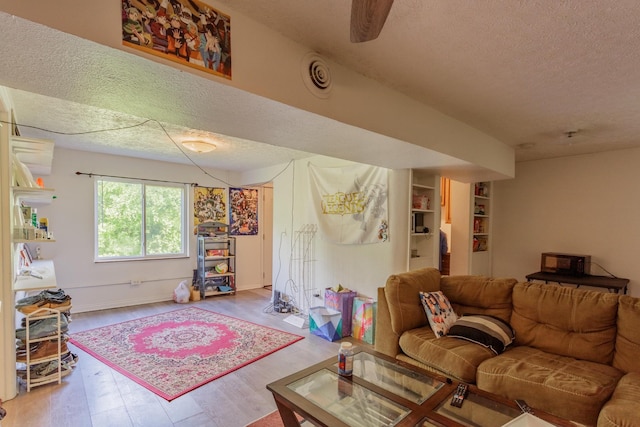 3913 Pickering Ave, Chattanooga, TN 37415 - living area with a textured ceiling, wood finished floors, and baseboards