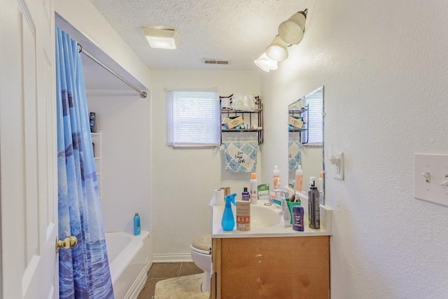 3913 Pickering Ave, Chattanooga, TN 37415 - bathroom featuring tile patterned floors, a textured ceiling, toilet, vanity, and shower / bath combo with shower curtain