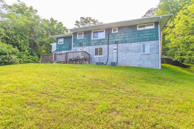 3913 Pickering Ave, Chattanooga, TN 37415 - rear view of house with a yard, a wooden deck, and central AC