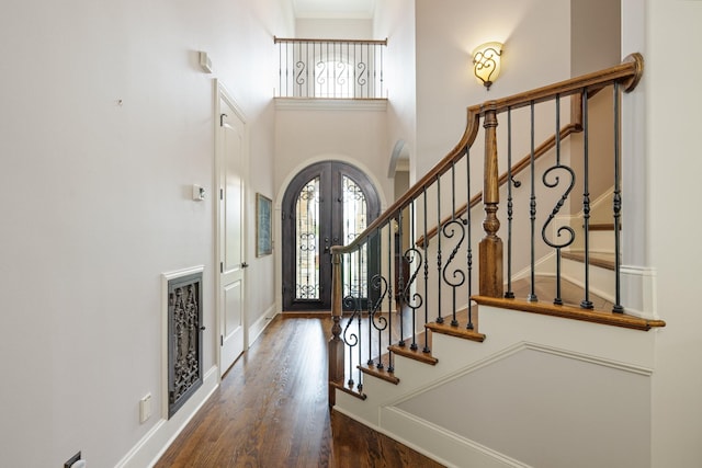 109 Allenhurst Cir, Franklin, TN 37067 - foyer entrance featuring healthy amount of natural light, wood finished floors, stairs, arched walkways, and a towering ceiling