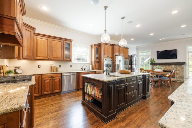 109 Allenhurst Cir, Franklin, TN 37067 - kitchen featuring stainless steel appliances, a sink, decorative backsplash, light stone counters, and crown molding