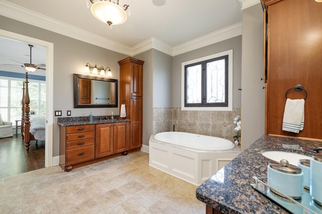 109 Allenhurst Cir, Franklin, TN 37067 - ensuite bathroom featuring two vanities, ornamental molding, a garden tub, and ceiling fan