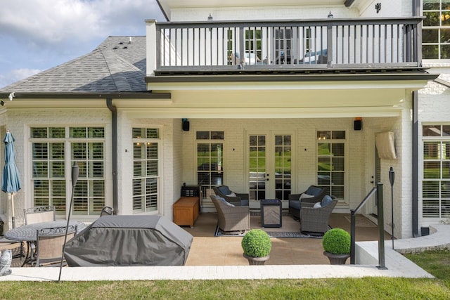 109 Allenhurst Cir, Franklin, TN 37067 - back of house with a balcony, brick siding, french doors, outdoor lounge area, and a shingled roof
