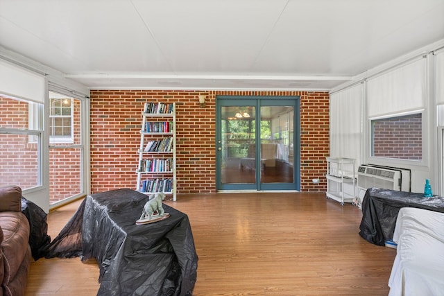 1403 Manor Rd, Columbia, TN 38401 - living area featuring wood finished floors and brick wall
