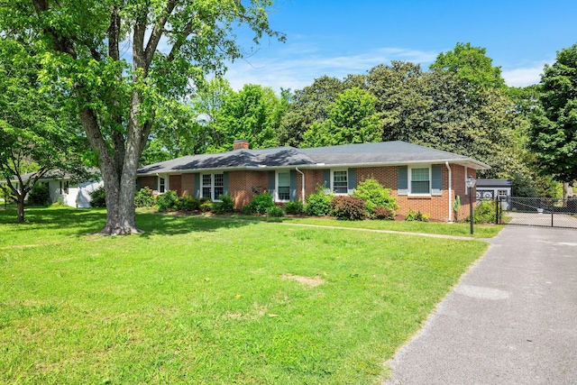 1403 Manor Rd, Columbia, TN 38401 - single story home featuring a gate, brick siding, a chimney, and asphalt driveway