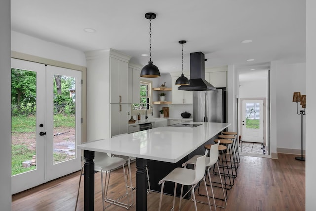 kitchen featuring black appliances, island exhaust hood, open shelves, light countertops, and white cabinetry