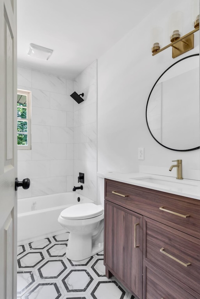 full bathroom with toilet, vanity, and washtub / shower combination