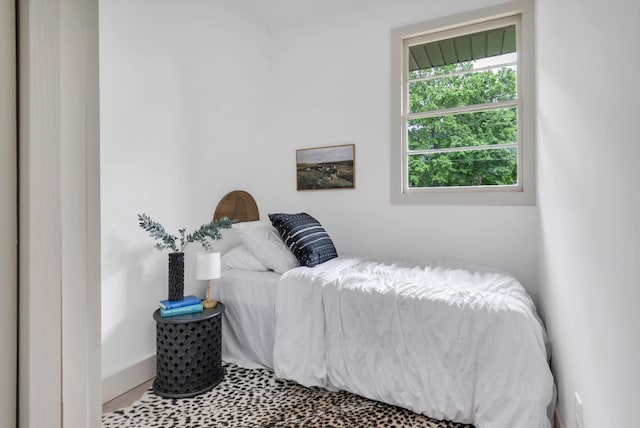 bedroom featuring baseboards