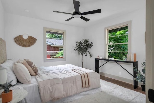 bedroom featuring wood finished floors and ceiling fan