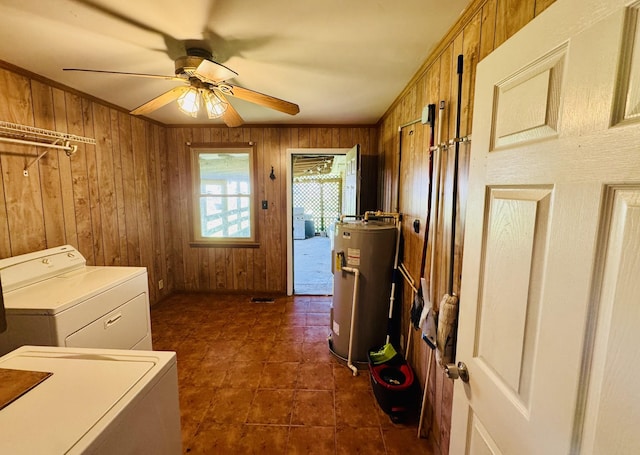 202 Tomlinson Rd, Lebanon, TN 37087 - laundry room with water heater, washing machine and clothes dryer, wooden walls, a ceiling fan, and dark tile patterned floors