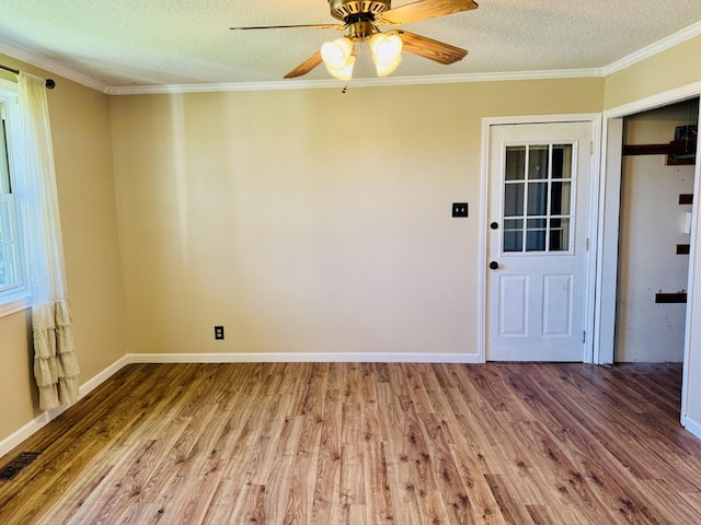 202 Tomlinson Rd, Lebanon, TN 37087 - empty room with wood finished floors, a textured ceiling, ceiling fan, crown molding, and baseboards