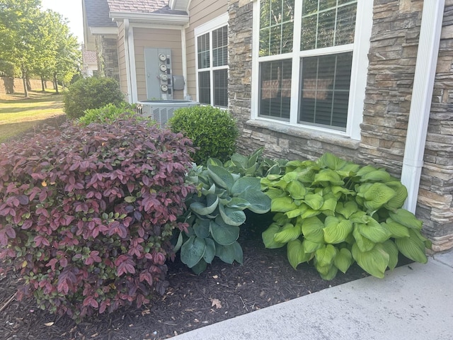 exterior view of stone siding and central AC unit
