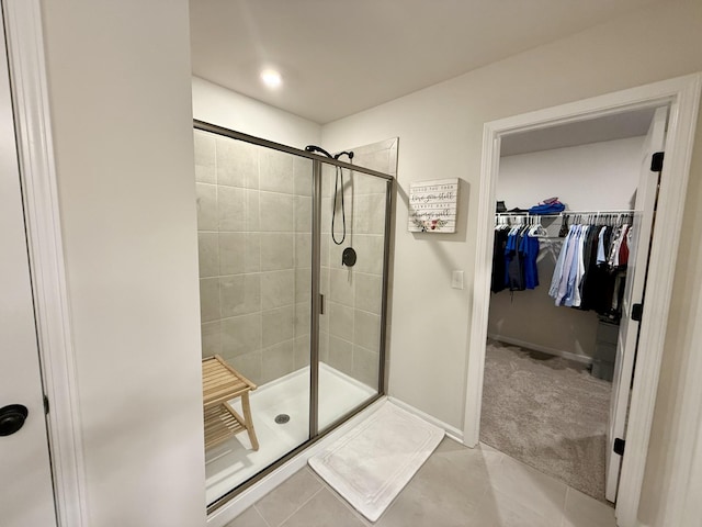 4524 Hoboken Way, Murfreesboro, TN 37128 - bathroom featuring tile patterned floors, a shower stall, a walk in closet, and baseboards
