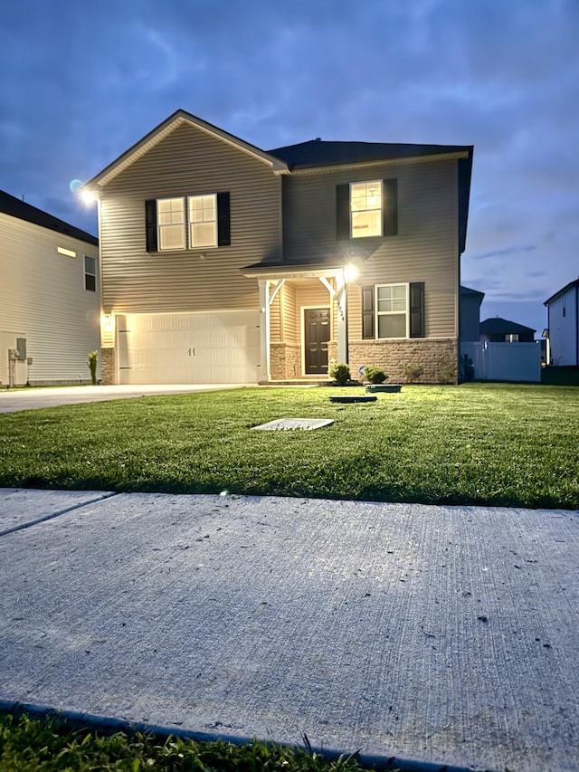4524 Hoboken Way, Murfreesboro, TN 37128 - view of front of home with an attached garage, a front lawn, concrete driveway, and stone siding