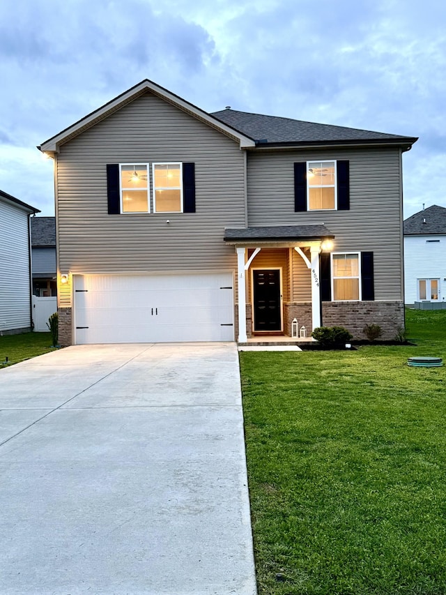 4524 Hoboken Way, Murfreesboro, TN 37128 - view of front of home featuring a garage, concrete driveway, brick siding, and a front yard