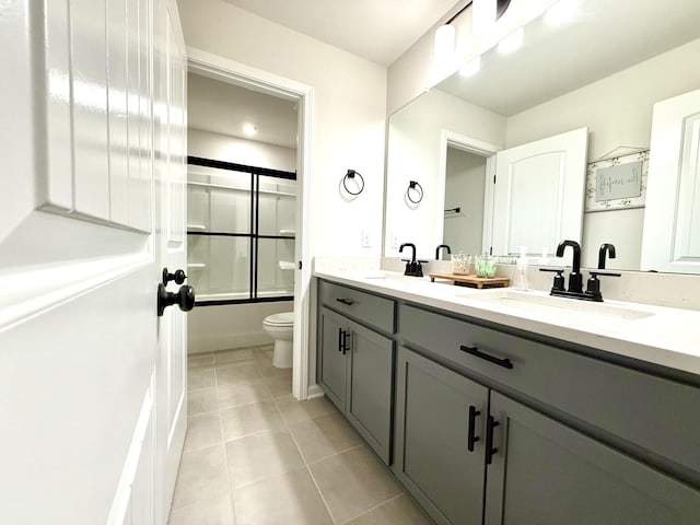 4524 Hoboken Way, Murfreesboro, TN 37128 - bathroom featuring toilet, tile patterned flooring, double vanity, and enclosed tub / shower combo