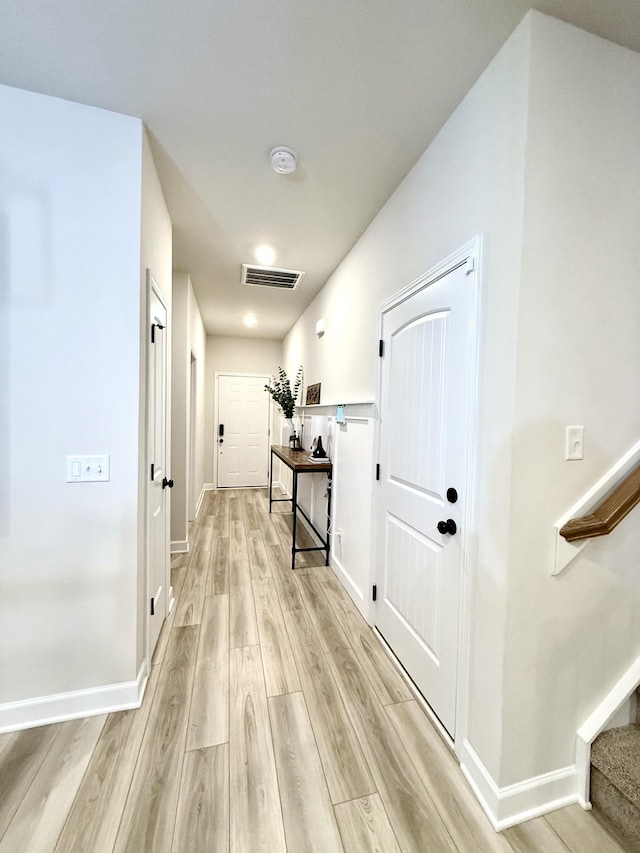 4524 Hoboken Way, Murfreesboro, TN 37128 - hallway featuring light wood-type flooring, stairway, and baseboards