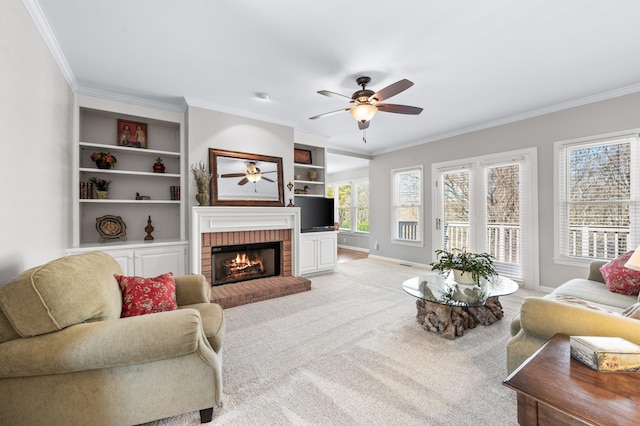 6716 Autumnwood Dr, Nashville, TN 37221 - living area with a ceiling fan, ornamental molding, a fireplace, baseboards, and light carpet