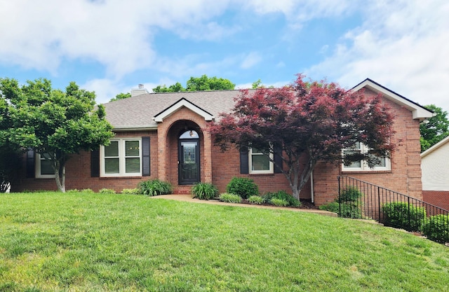 6716 Autumnwood Dr, Nashville, TN 37221 - ranch-style house featuring brick siding, a front yard, a shingled roof, and a chimney
