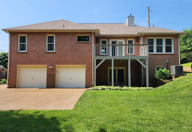 6716 Autumnwood Dr, Nashville, TN 37221 - back of house with driveway, an attached garage, a chimney, a yard, and brick siding